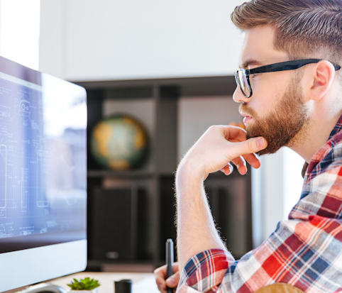 man looking at computer screen